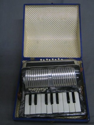 A childs Fiellina accordion with 8 buttons, cased