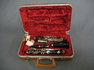 A plastic Bossey & Hawke Regent clarinet, cased