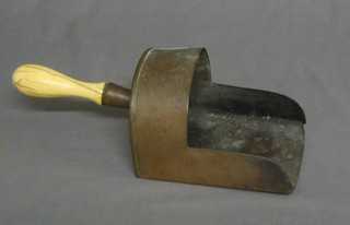 A handsome Victorian copper coal shovel with turned ivory handle