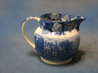 A 19th/20th Century Woodsware blue and white pottery jug decorated a watermill, 6"