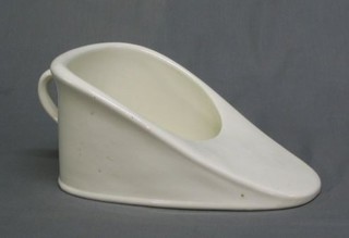 A white glazed slipper bed pan