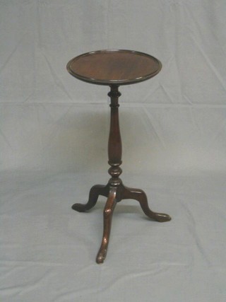 A circular turned mahogany wine table, raised on pillar and tripod supports 12"
