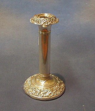 An Edwardian embossed silver candlestick Birmingham 1907 8"