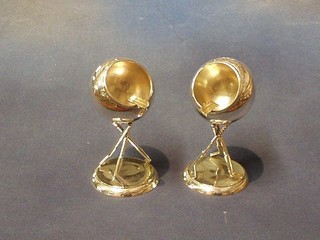 A handsome pair of Art Deco silver plated golf trophy ashtrays in the form of golf balls, supported by golf irons 6"