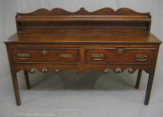 An 18th Century oak dresser base, with raised back, the base fitted 2 drawers with pierced apron raised on square supports 60" (made up)