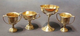 A goblet shaped silver trophy and 3 small silver trophy cups 7 ozs