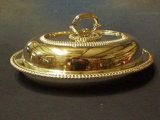 An oval silver plated entree dish and cover by Elkingtons