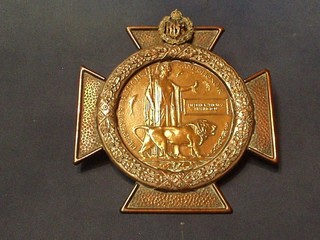 A Royal Flying Corps "Death Plaque" to Frederick Thomas  Brasington, contained in an embossed copper wreath and cross frame, marked 1914-1915 and surmounted by a Royal Flying Corps cap badge by Wright & Sons Edgware, Middlesex