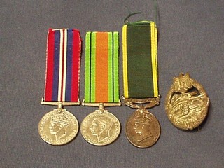 A group of 3 medals to Lieutenant A E Havley R.E.M.E. comprising British War medal, Defence medal, George V issue Territorial Efficiency medal together with a Nazi German badge decorated a tank and with original boxes of issue