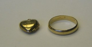 A 9ct gold wedding band and a 9ct gold heart shaped locket