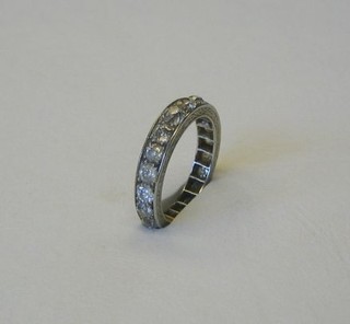 An eternity ring set white stones