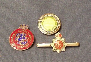 A Southdown Motor Company silver and enamel 25 Year Service badge, a silver and enamel National Fire Service sweetheart brooch and an enamelled National Savings badge