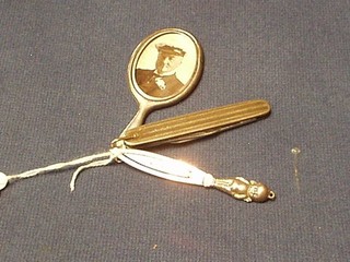 A silver gilt pen knife, a silver book mark and a miniature silver hand mirror