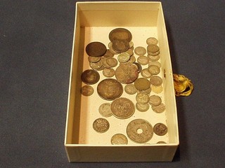 A bronze token and a collection of various silver coins