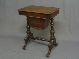 A Victorian figured walnutwood sewing box with hinged lid and deep basket, raised on carved bulbous turned supports united by H framed stretcher, complete with contents of sewing equipment 22"