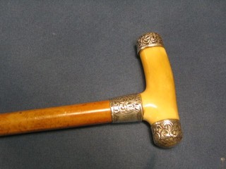 A Malacca walking stick with ivory and embossed silver handle
