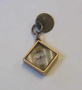 A gilt metal cased watch fob in the form of a seal