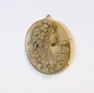 A handsome 19th Century lava carved cameo brooch in the form of a lady