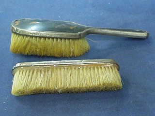 An Art Deco silver and tortoiseshell 2 piece dressing table set with clothes brush and hair brush, London 1933 and 1934
