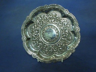An Eastern embossed silver salver with bracketed border 8"