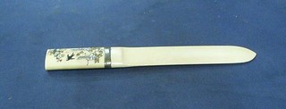 A 19th Century ivory paper knife, the grip inlaid fabulous birds with silver banding 9 1/2"