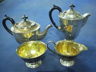 An Art Deco 4 piece silver plated tea service comprising teapot, hotwater jug, sugar bowl and cream jug