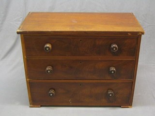 A Victorian mahogany chest of 3 long drawers raised on bracket feet, of small proportions 37"