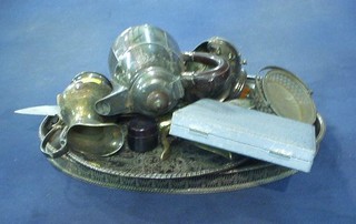 A silver plated hotwater jug, an oval pierced silver plated galleried tea tray and other items of plate