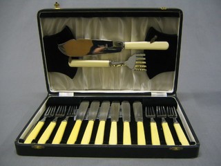 A set of 6 silver plated fish knives and forks together with servers contained in a fibre canteen box