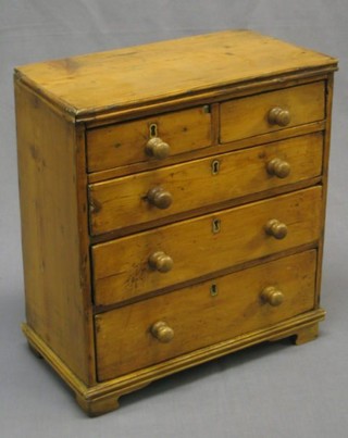 A 19th Century style pine apprentice chest of 2 short and 3 long drawers with tore handles 13"