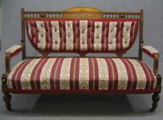 A fine quality Victorian inlaid mahogany 9 piece drawing room suite comprising open arm sofa, 2 open arm chairs, 6 standard chairs (1f) with bobbin turned decoration, inlaid throughout and upholstered in Regency stripe material, raised on turned and simulated fluted supports