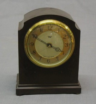 An Art Deco Smiths electric mantel clock contained in an arched Bakelite case