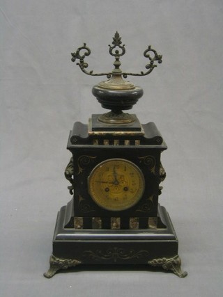 A  19th Century French 8 day striking mantel clock with gilt dial contained in a black marble architectural case surmounted by an urn