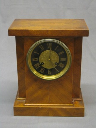 A 19th Century French 8 day striking mantel clock with  pixie gilt dial, Roman numerals contained in a walnut case