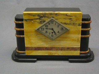 An 8 day Art Deco mantel clock contained in a 3 colour marble case