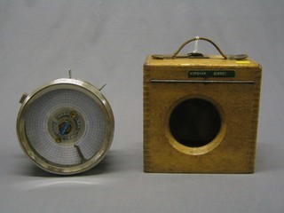 A 1930's racing pigeon clock "The Automatic Timing Clock Co. Ltd", contained in a circular chromium plated case with carrying case