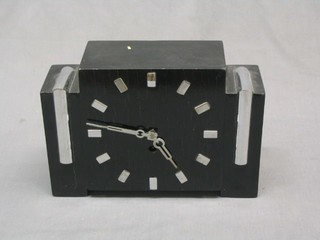 An Art Deco  8 day striking mantel clock contained in an ebonised case with chromium plated numerals