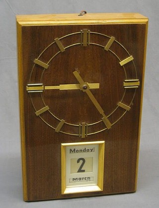 A 1950's electric wall clock "The Burk Calendar Clock" contained in a walnutwood case