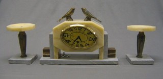 A French Art Deco 3 piece clock and garniture set comprising mantel clock with oval dial and Arabic numerals contained in a 2 colour marble case surmounted by 2 seated birds and 2 side pieces