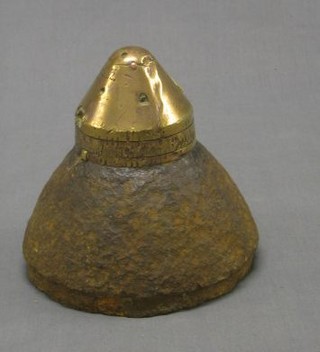 A WWI iron and brass German shell case nose cone, recovered from a French field, marked Doppz 92