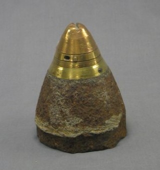 A WWI iron and brass British shell case nose cone, recovered from a French field