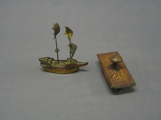 A mahogany and parquetry blotter 6" and a copper and brass model of a galleon 6"