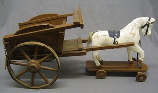 A childs push-a-long model of a white horse 15", a wooden model cart 28" and 4 turned skittles