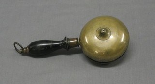 A brass handle bell