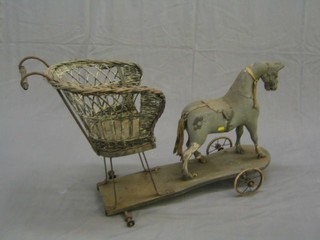 A childs Victorian push-a-long horse with wicker chair to the back
