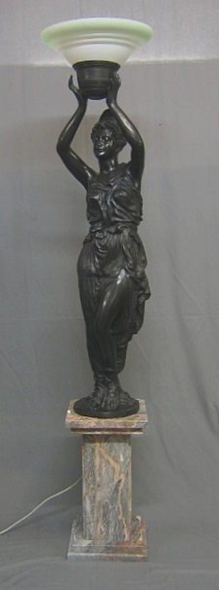 Monuau, after, an impressive bronze standard lamp in the form of a standing classical lady with urn raised above her head, raised on a marble base, 78" overall