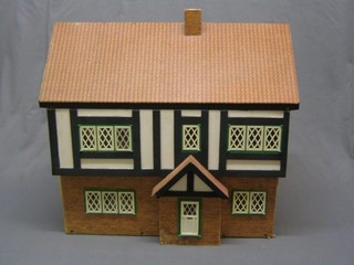 A childs mock Tudor dolls house 27" complete with contents of furniture
