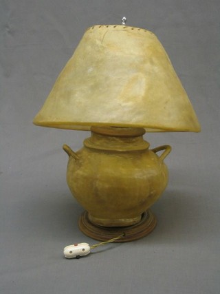 A 1930's hide twin handled table lamp and shade