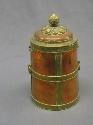 A 20th Century cylindrical Tibetan copper and brass jar and cover 11"