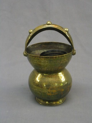 An Eastern engraved brass "spittoon" with carrying handle 7"  and 3 iron bells